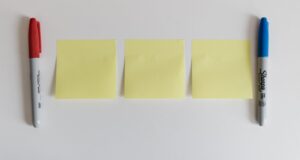 3 post it notes and 2 pens